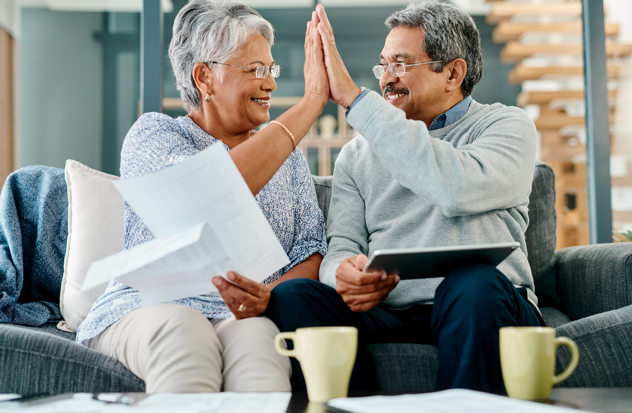 Indiana Gold IRA Investing Company getty couple high five happy